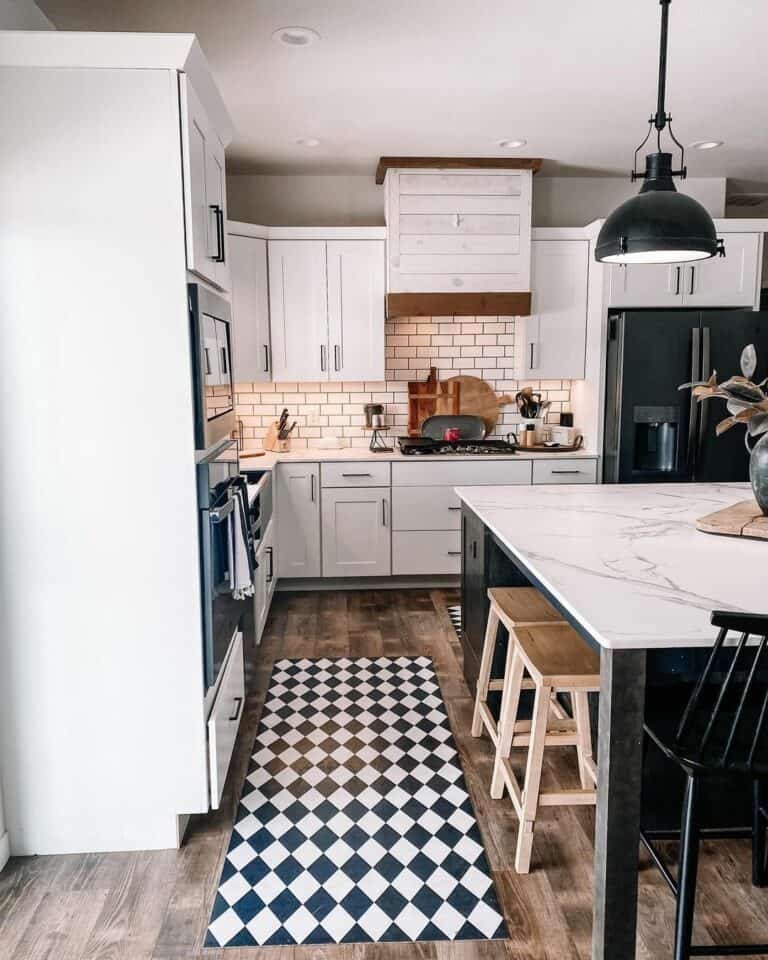 Black and white kitchen with marble island