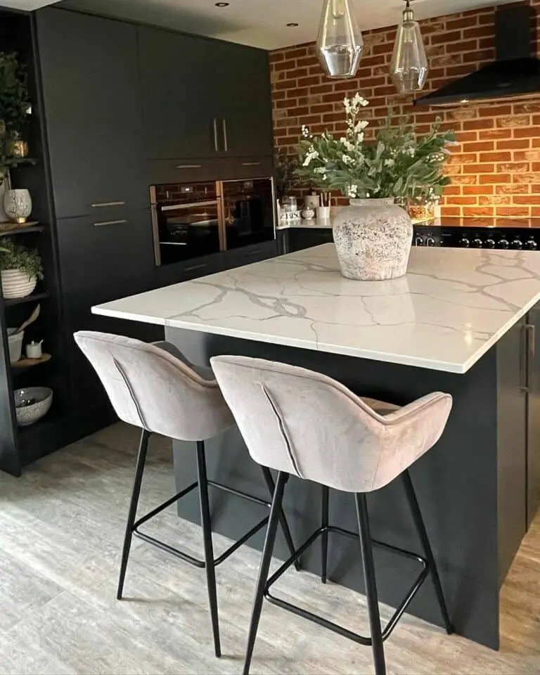 Black cabinets, brick wall