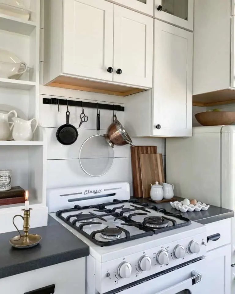 Black Countertop in White Farmhouse Kitchen