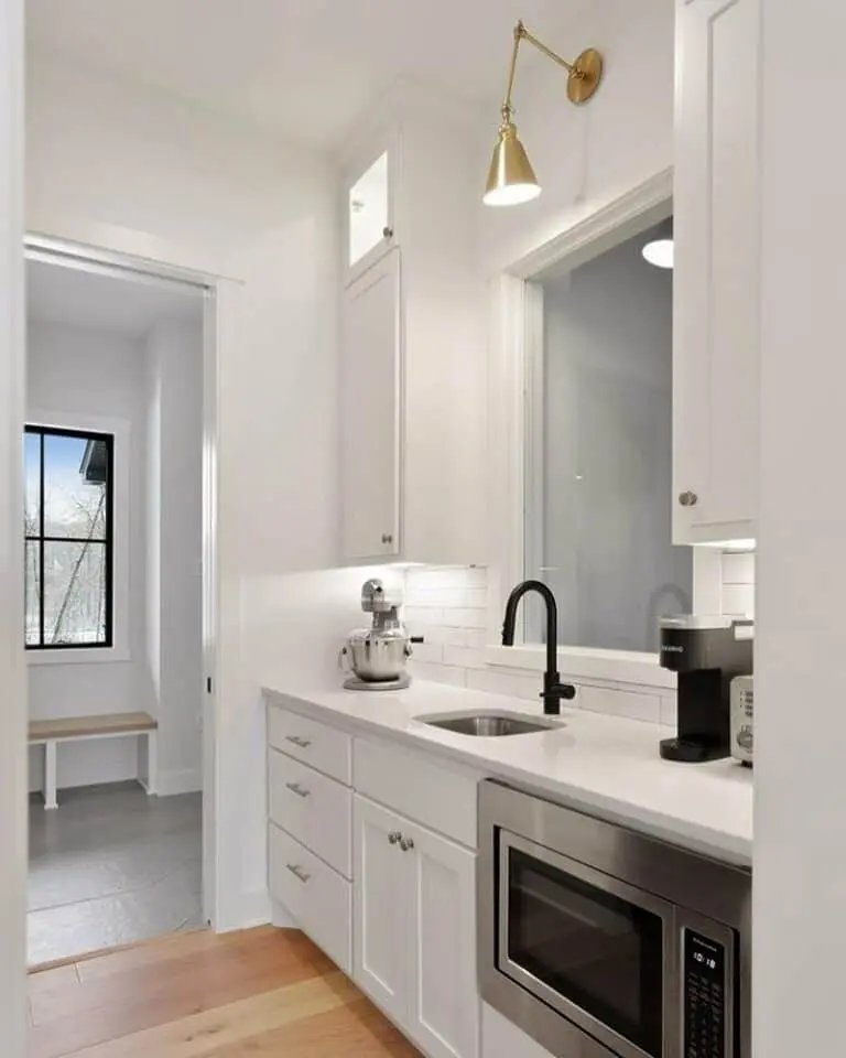 Black faucet, white cabinets