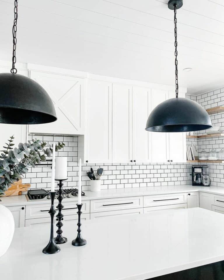 Black island, white tile kitchen