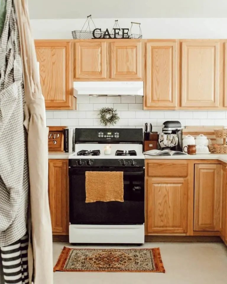 Bright oak cabinets with subway tiles