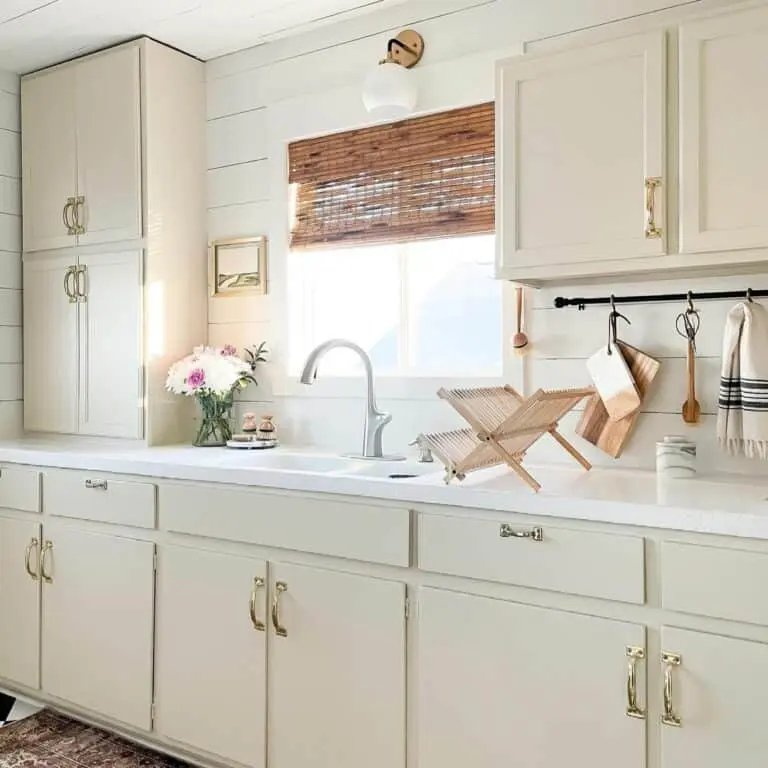 Cream cabinets, rattan blinds