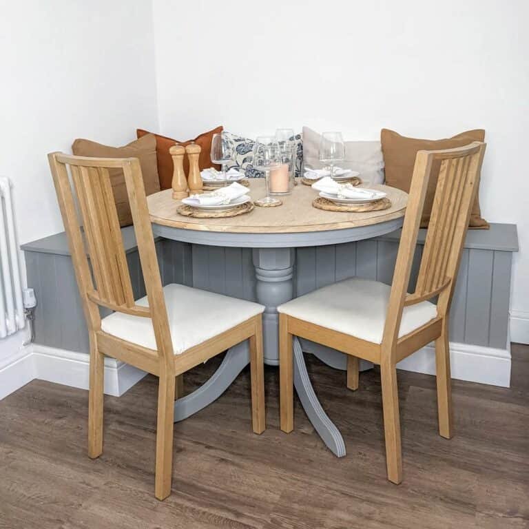 Gray shiplap banquette with accent pillows