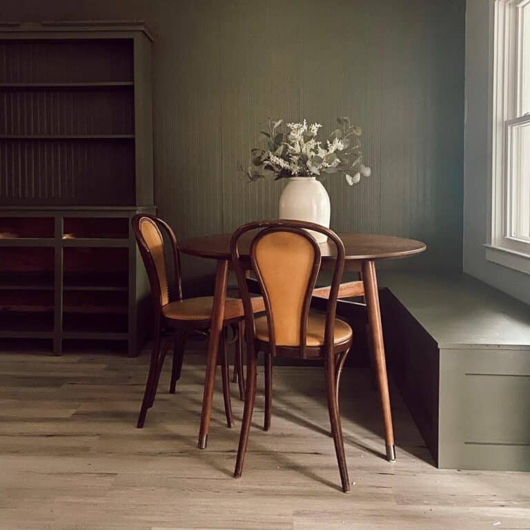 Green banquette with wood table