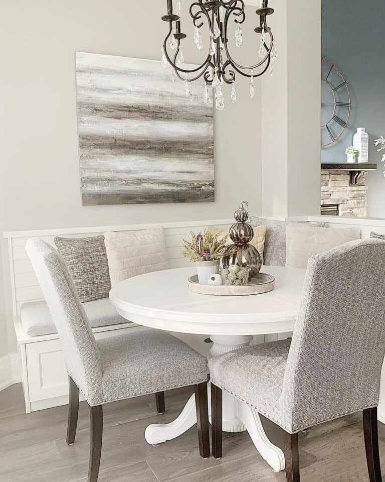 White banquette with chandelier