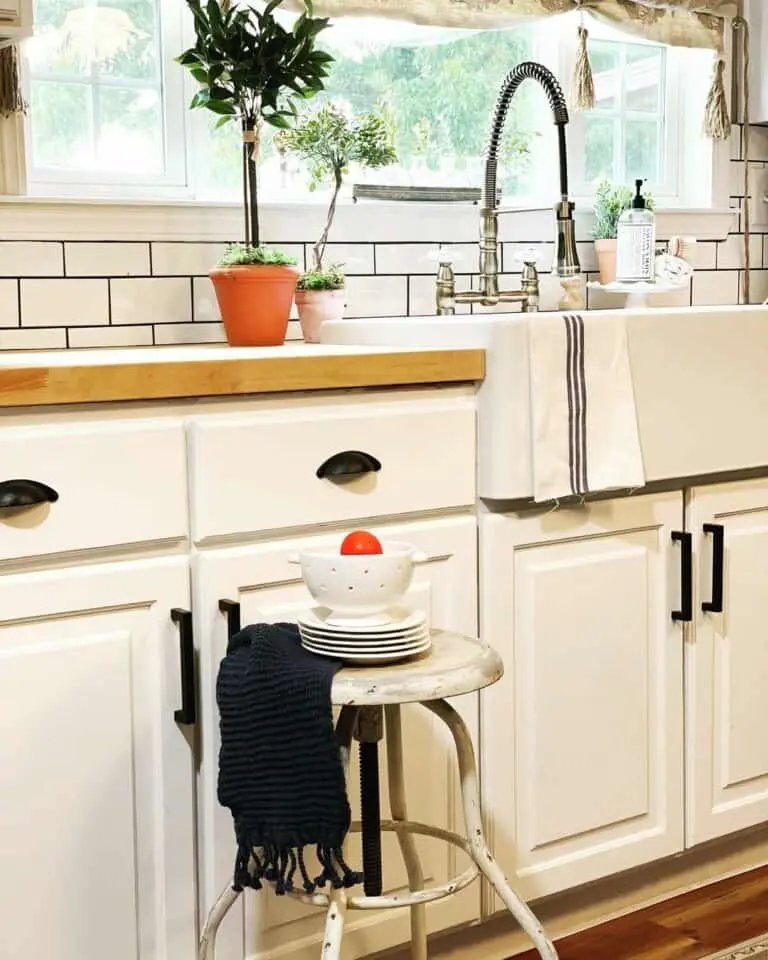 White cabinets with apron sink