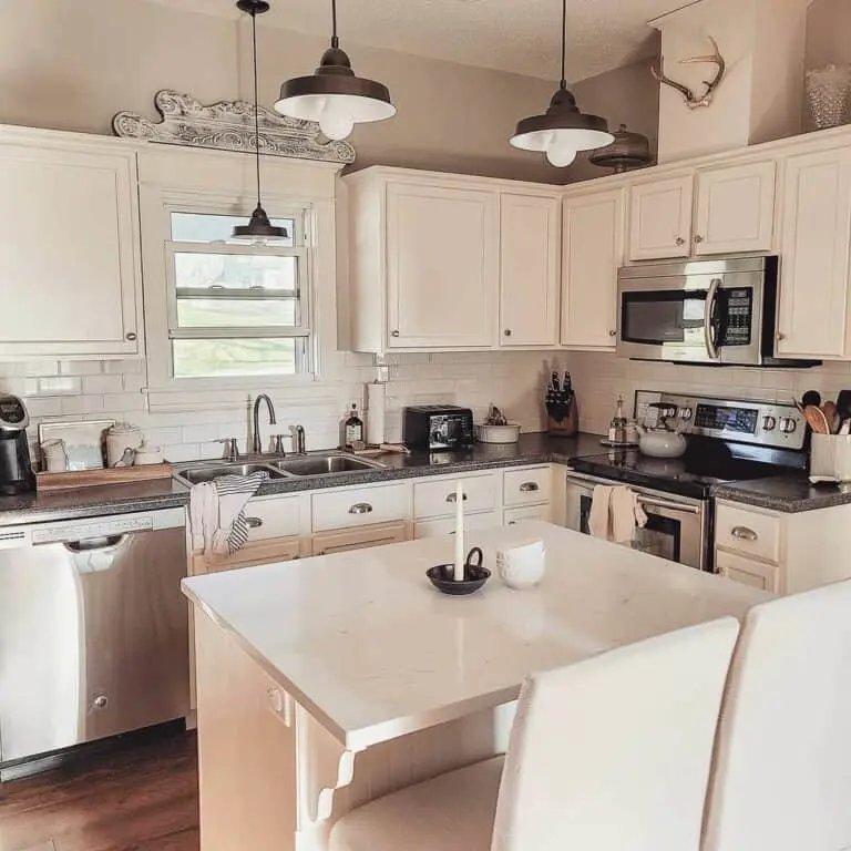 White cabinets with marble island