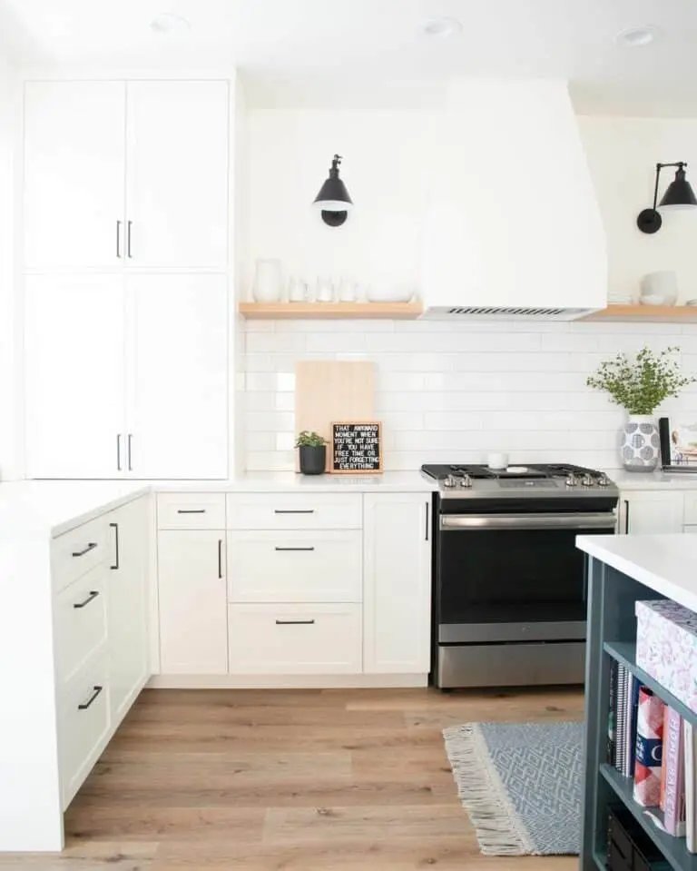 White kitchen with black lamps