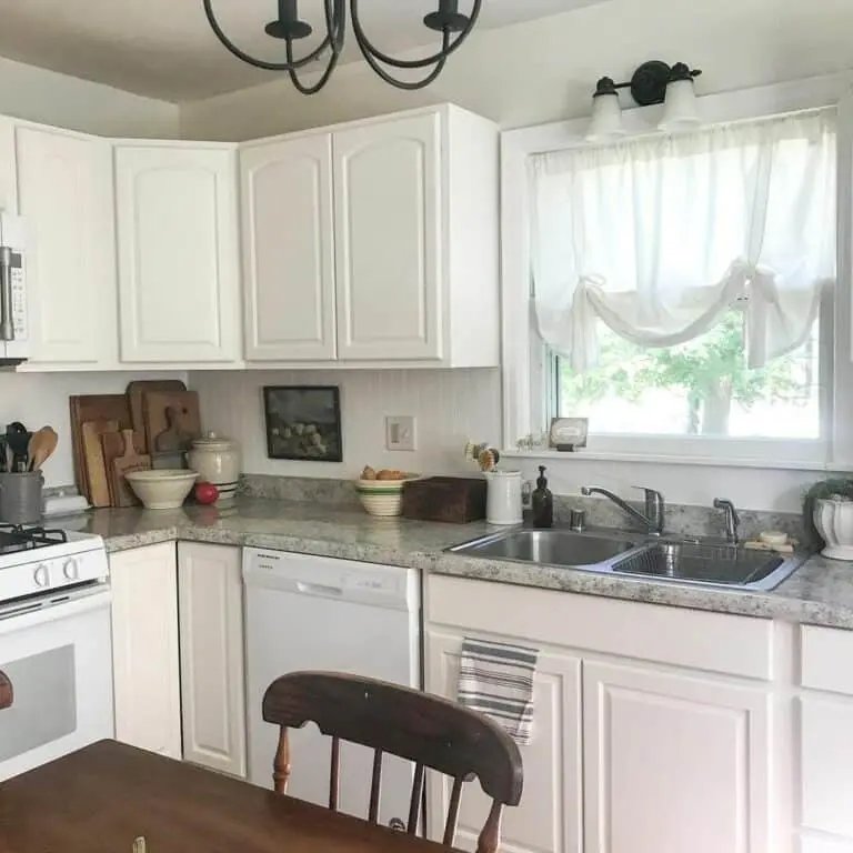 White kitchen with gray countertop