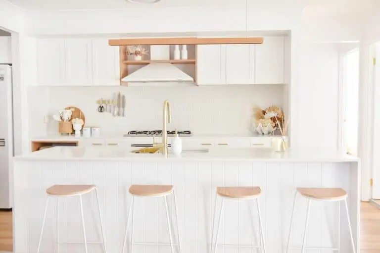 White kitchen with light wood elements