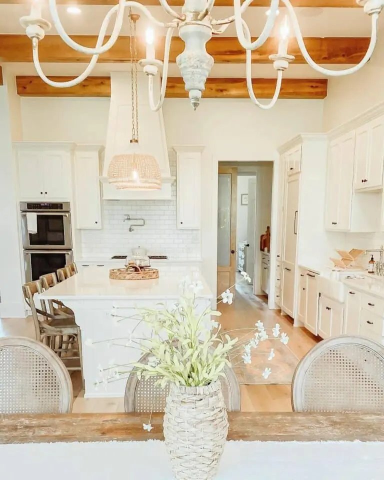 White kitchen with wood beams
