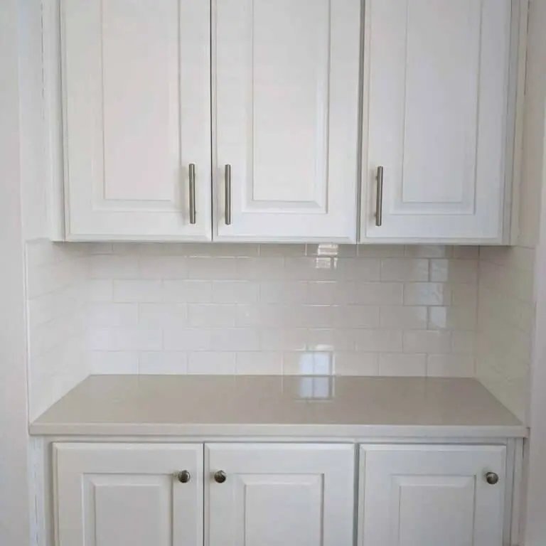 White pantry with tile walls