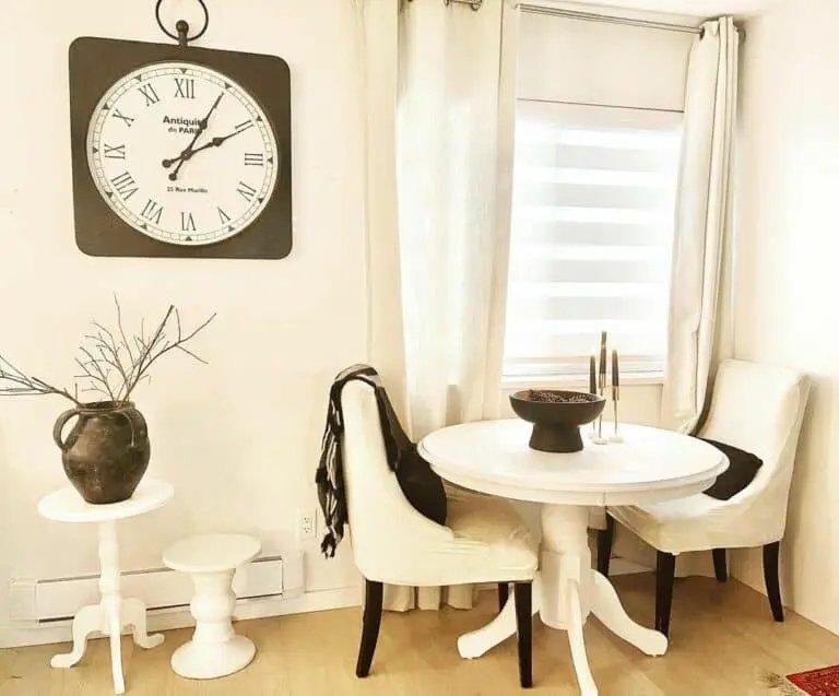 White pedestal tables, antique clock