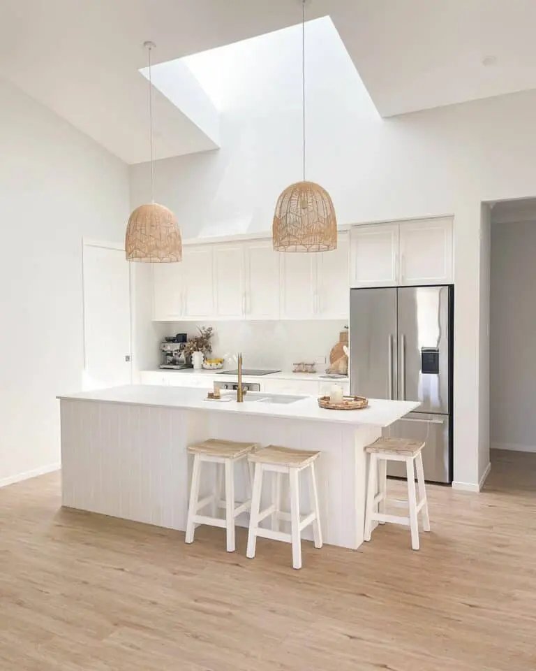 White shiplap island with rattan lights