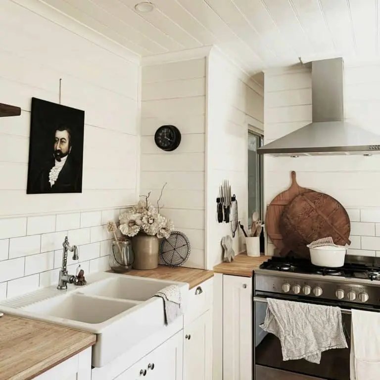 White shiplap kitchen with butcherblock countertop