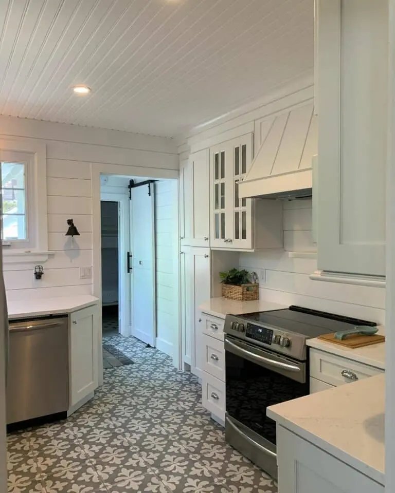 White shiplap kitchen with mosaic floor